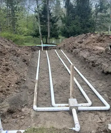 Septic drain field lateral layout in sand near a pond, installed by Landmark Enterprises in Chautauqua County, NY